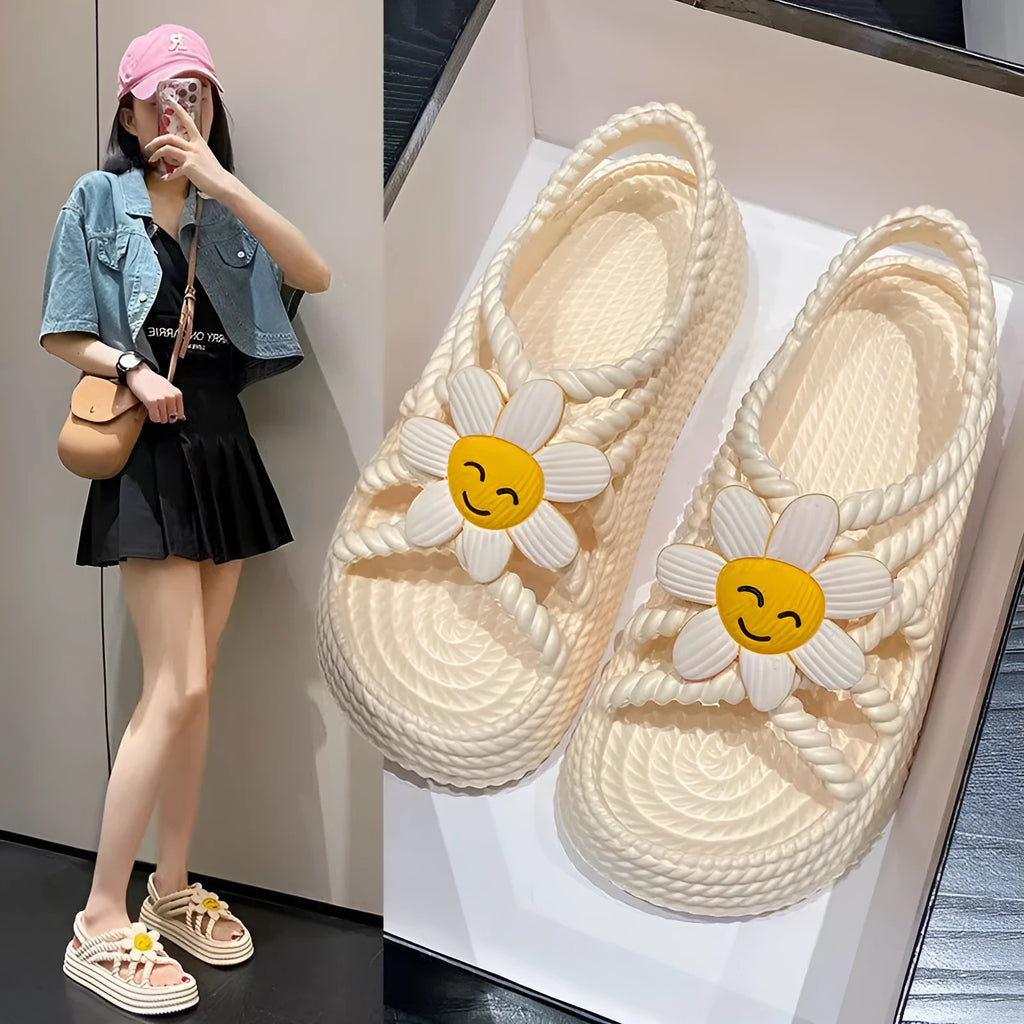 PVC round-toe sandals with a non-slip sole in beige colour with a sunflower decoration.