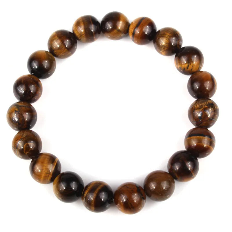 Natural tiger eye crystal bracelet with round beads in dark blue colour, showing tiger eye banding patterns