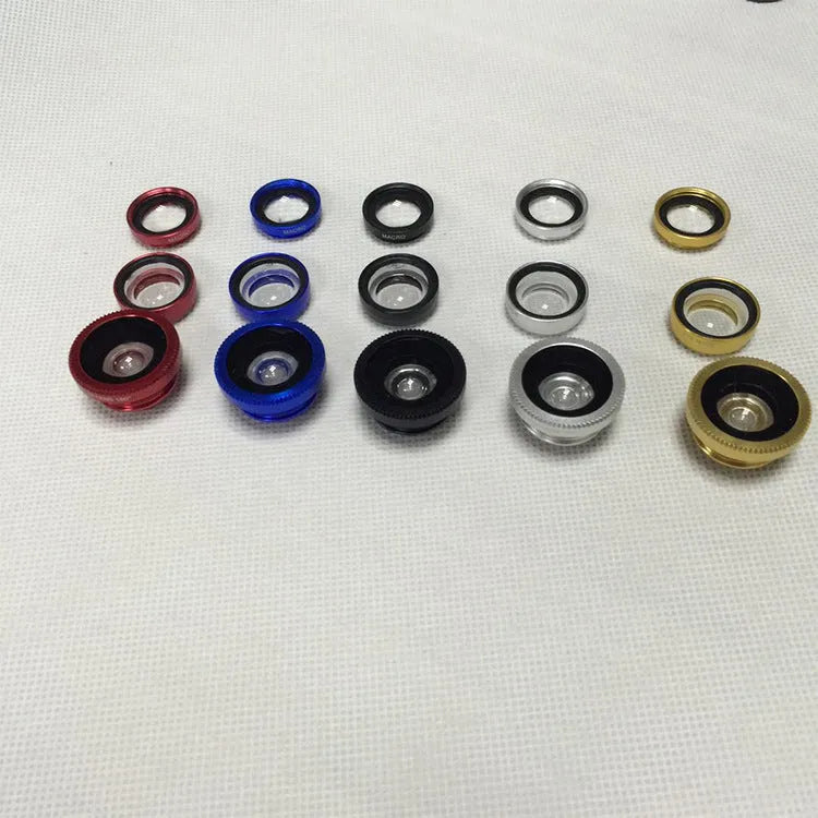 Three-in-one mobile phone lens kit showing fisheye, wide-angle, and macro clip-on attachments on a smartphone.
