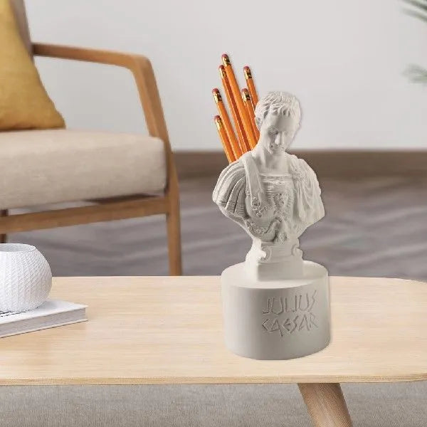 White American character modelling pen holder on desk holding multiple pens, 10cm tall synthetic resin organiser