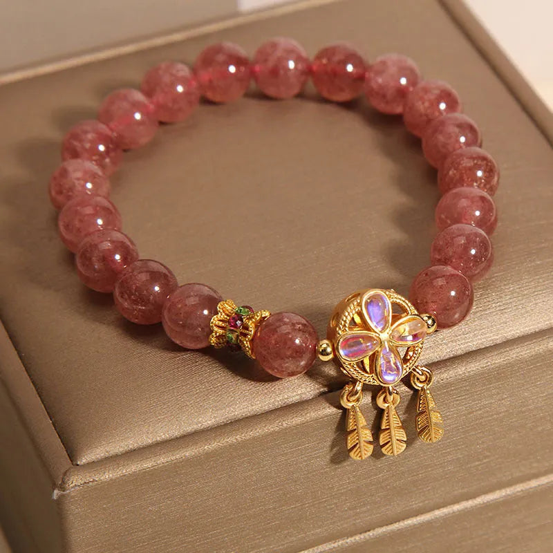 Strawberry quartz women's bracelet with four leaf clover dream catcher design and ball pendant charm