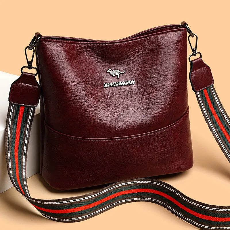 PU bucket bag 23.5x22x12cm with polyester lining and sandwich pocket in black, red, or yellow