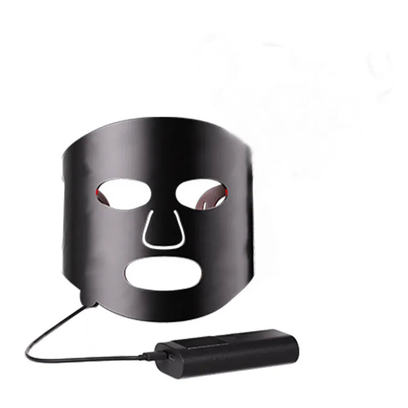 Black and gold LED phototherapy face mask with controller on a white background.