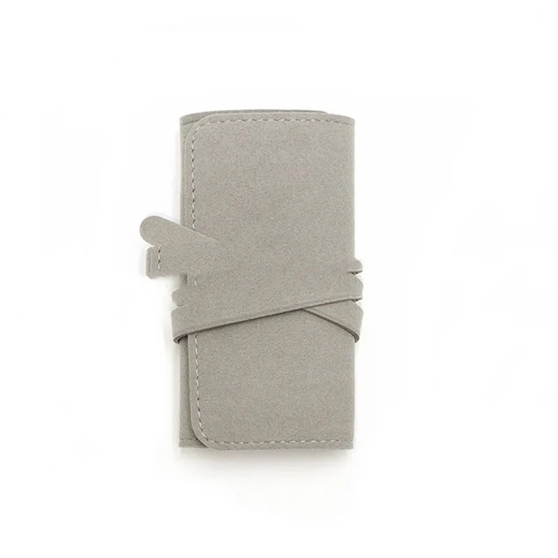 Square brown leather jewellery storage bag measuring 12x12cm for earrings and watches.