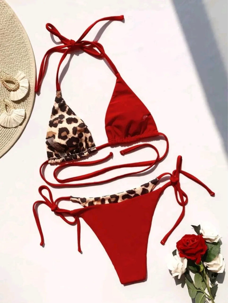 Women's leopard print halter bikini with lace-up detailing in red or black colours