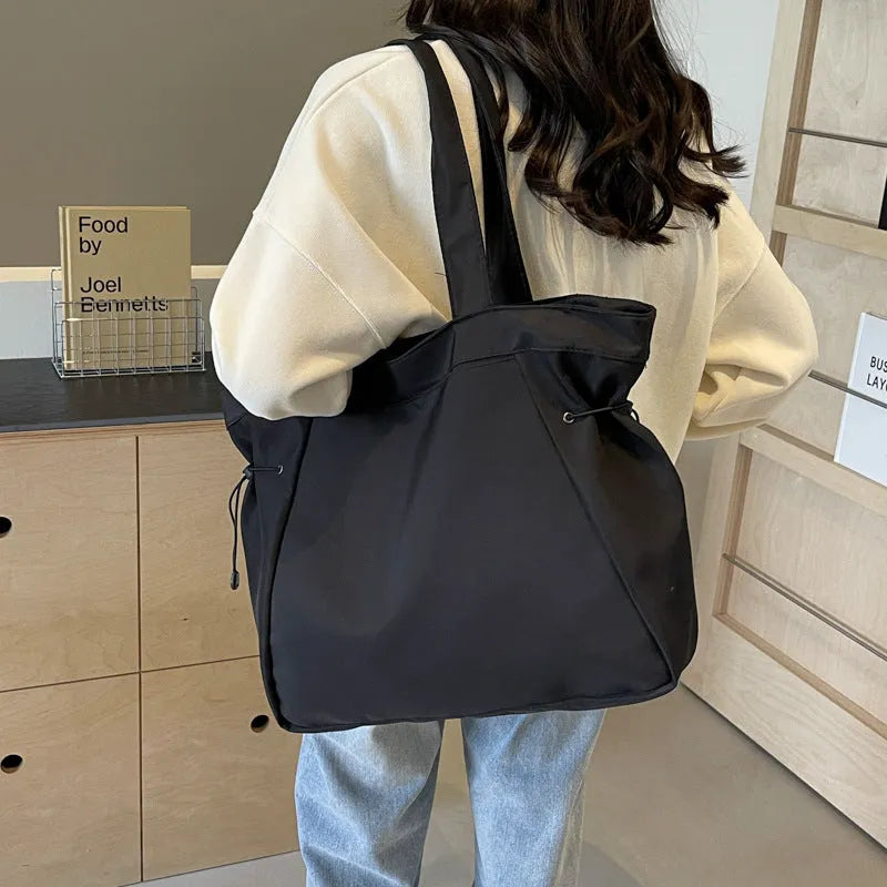 Soft foldable Oxford cloth tote bag in street style, shown in a choice of five colours.