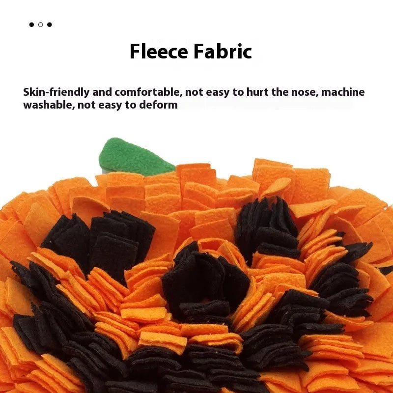 Orange pumpkin-shaped polar fleece pet lick mat for slow feeding and dog training.