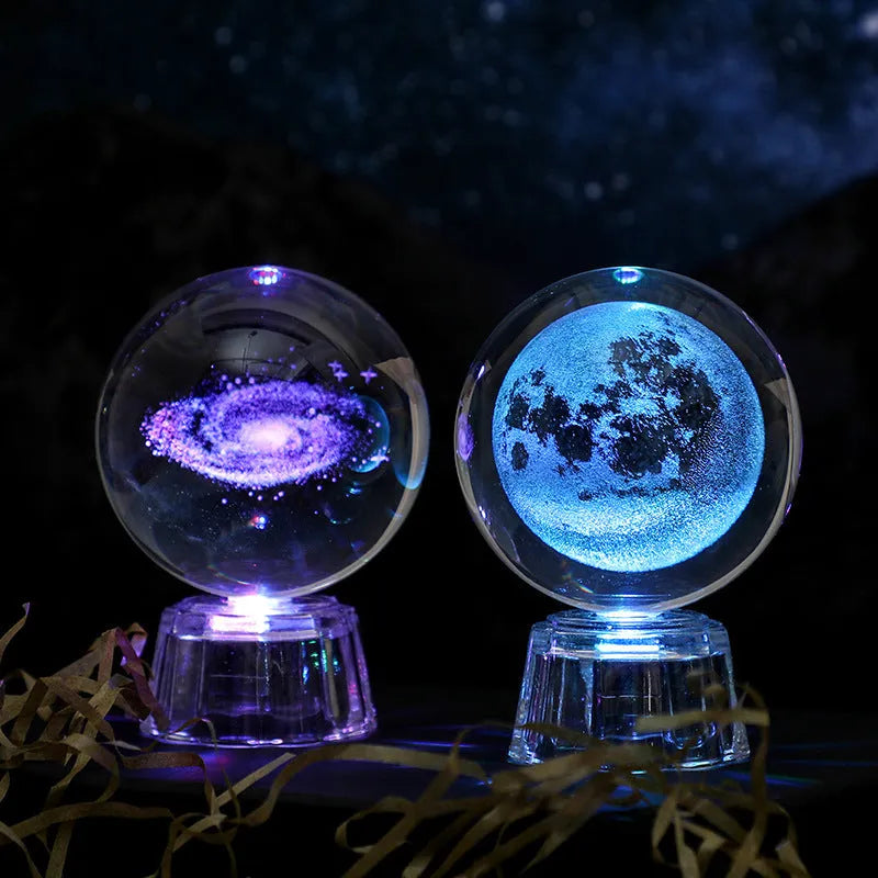 Transparent 6cm white crystal ball ornament with inner carving patterns illuminated by small night lamp on tabletop