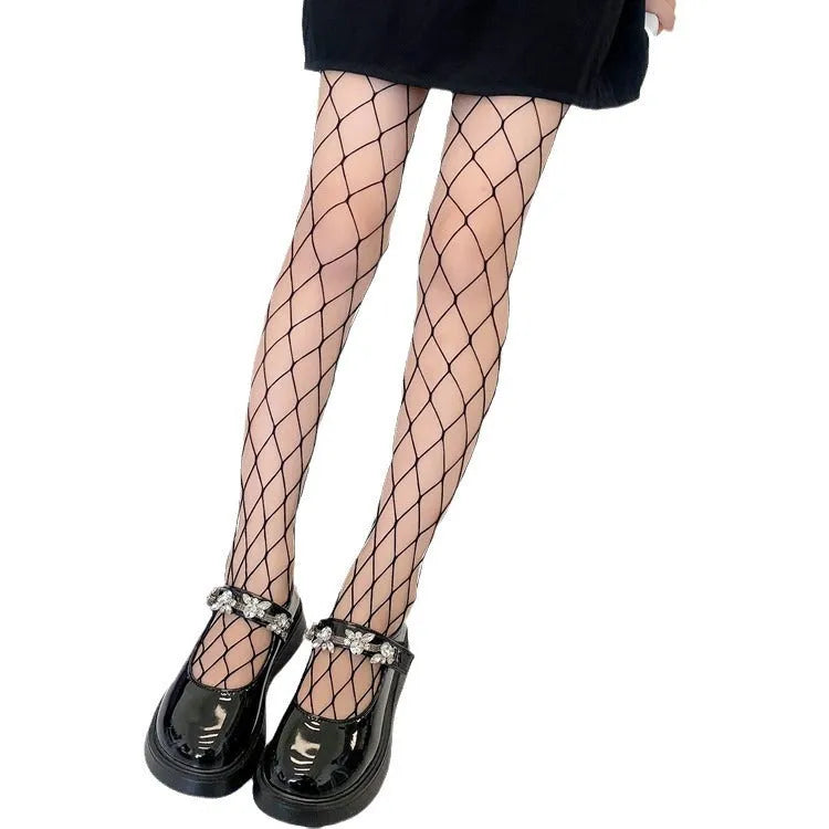 Women's mesh stockings showing large, medium and small net patterns in black and white colours on leg