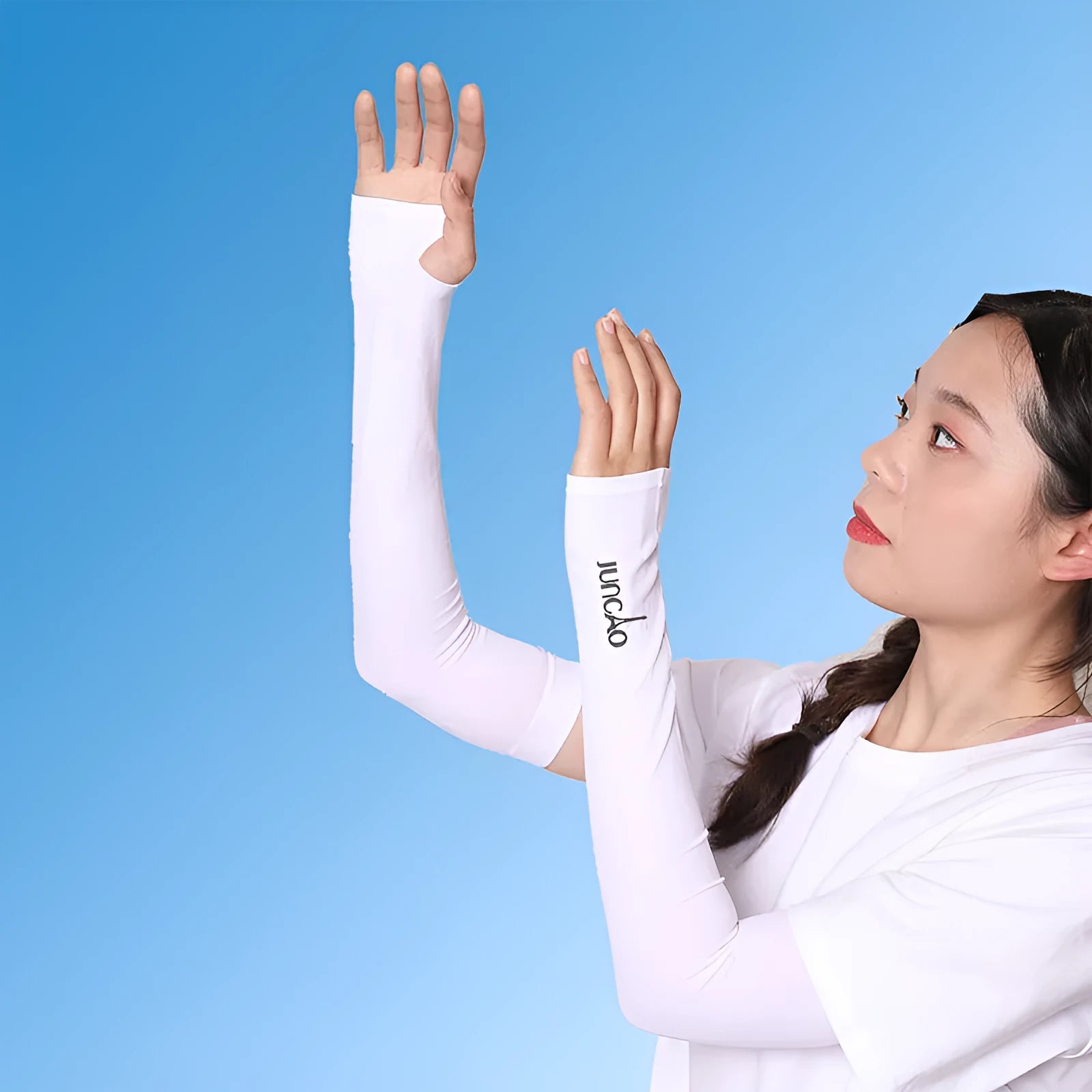 A pair of grey sun protection arm sleeves with an open-finger design on a neutral background.