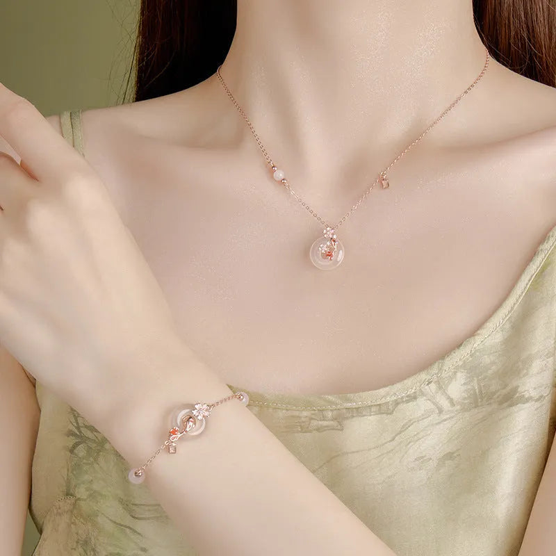 S925 sterling silver bracelet with white chalcedony crystal flower and engraved koi fish design.