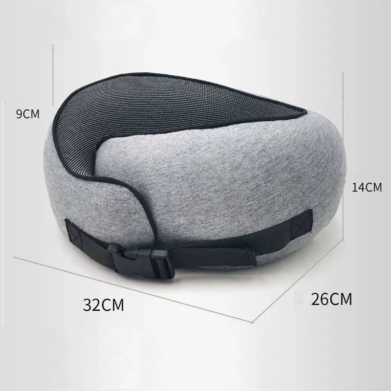 Navy blue U-shaped travel neck pillow with memory foam filling shown rolled and in its carry bag