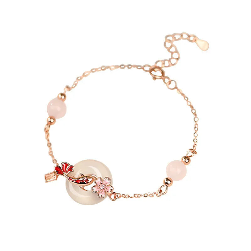 S925 sterling silver bracelet with white chalcedony crystal flower and engraved koi fish design.
