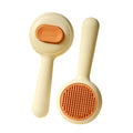 Cat grooming brush with stainless steel pins and non-slip handle in green or yellow colour