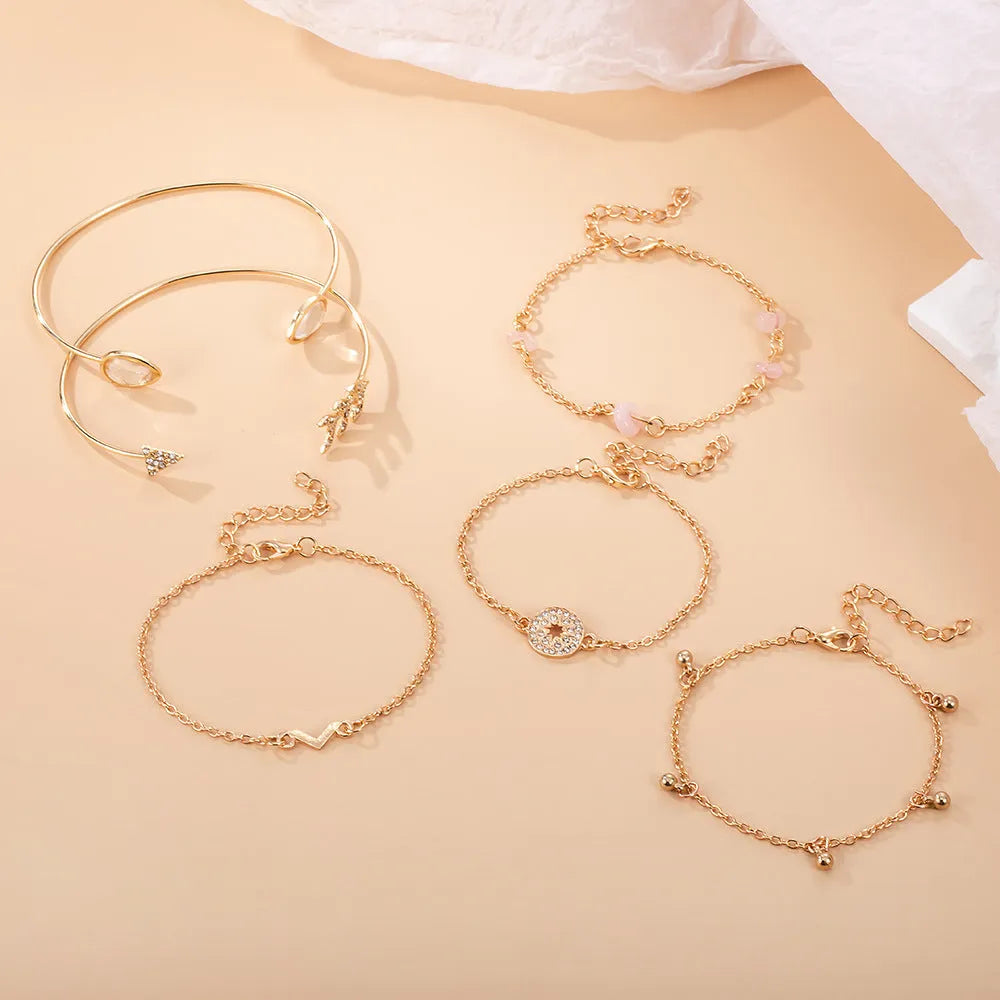 Women's six-piece gold colour zinc alloy bracelet set with arrow and water drop shaped charms