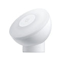 White Mijia Night Light 2 Bluetooth bedside lamp with human body induction, 94mm width, on wooden table