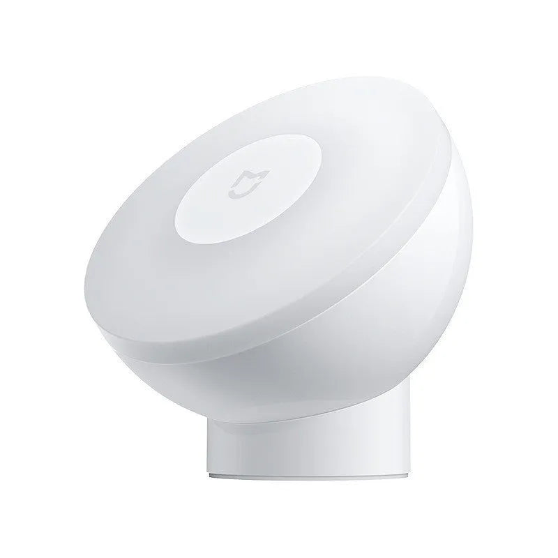 White Mijia Night Light 2 Bluetooth bedside lamp with human body induction, 94mm width, on wooden table