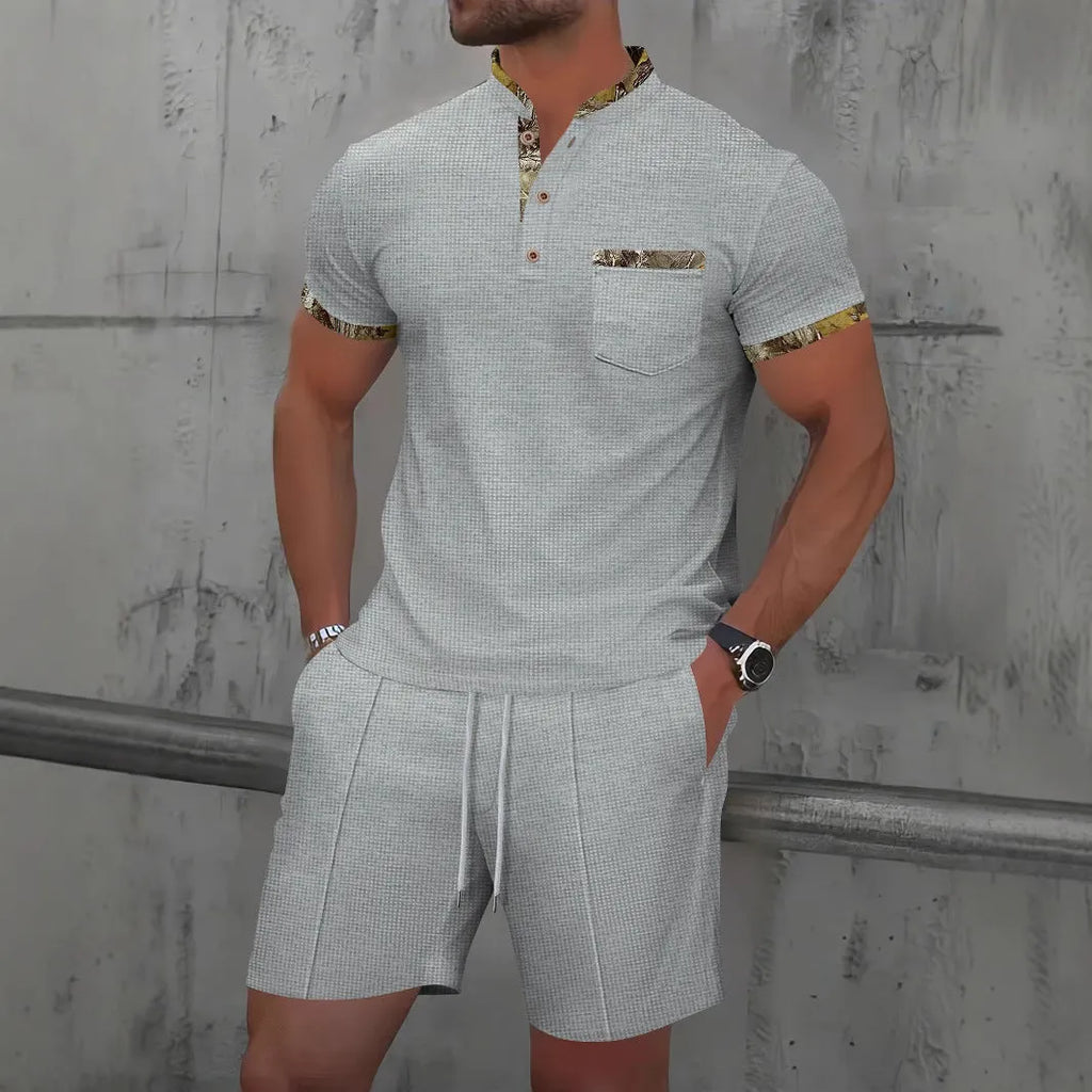 Men's grey waffle texture short sleeve suit with polo collar and matching shorts on hanger