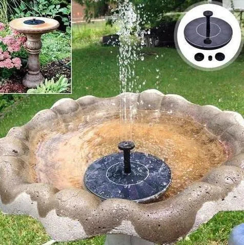 Black solar floating fountain with 4 nozzle attachments in garden pond setting