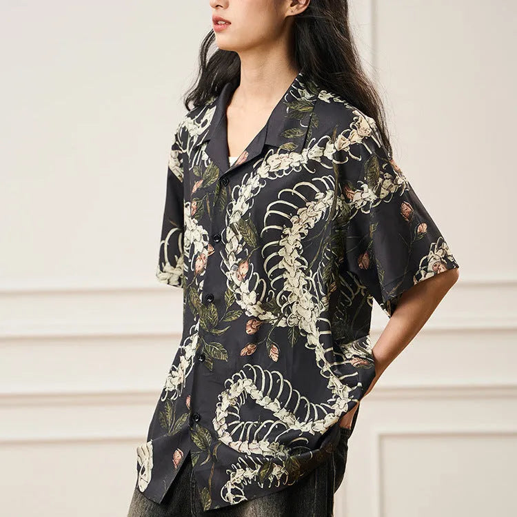 Snake bone floral pattern printed on light blue polyester Cuban collar shirt with short sleeves