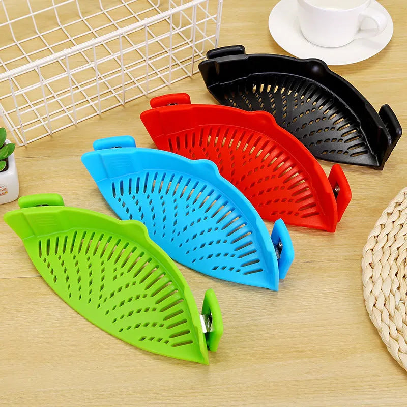 Silicone clip-on kitchen strainer with stainless steel mesh attached to pot rim for draining liquids