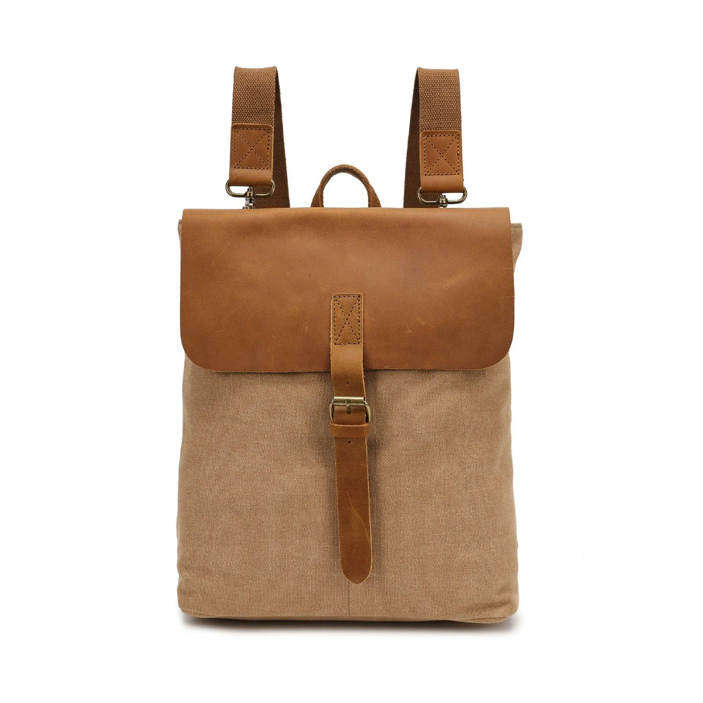 Minimalist Crazy Horse leather and canvas student backpack in neutral colours showing compact dimensions