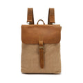 Minimalist Crazy Horse leather and canvas student backpack in neutral colours showing compact dimensions
