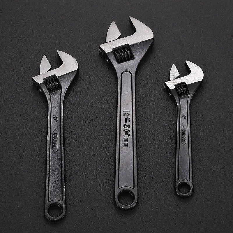 Stainless steel adjustable wrench with blackening treatment, ergonomic handle, and adjustable jaw for bolts up to 49mm