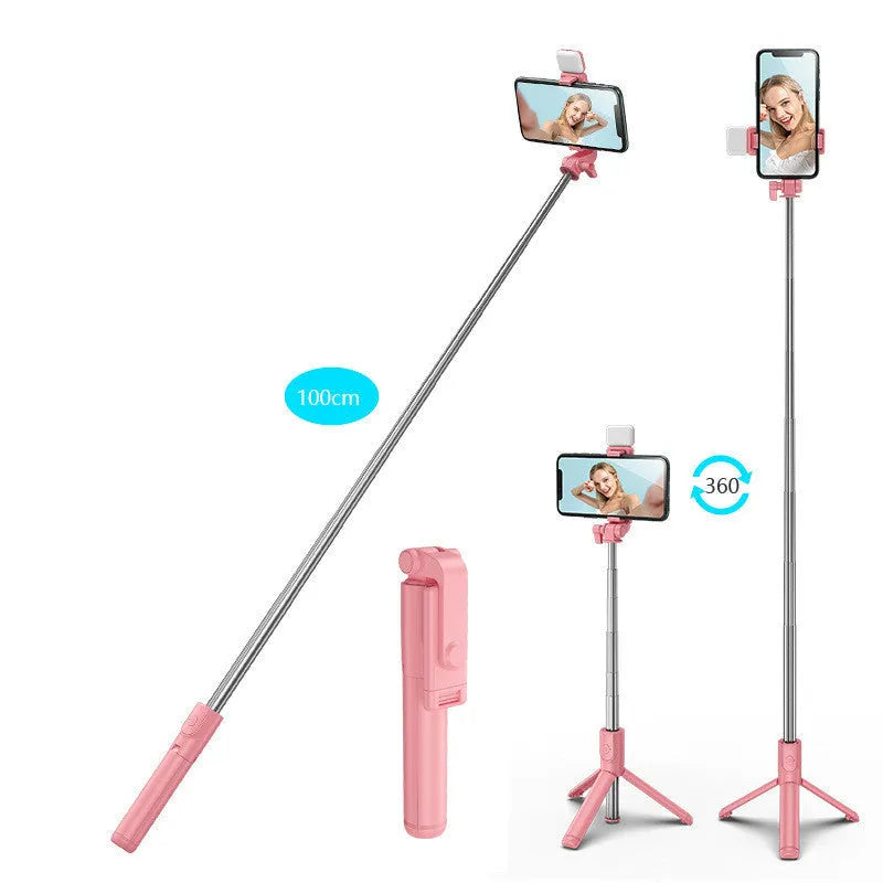 Black Bluetooth selfie stick with integrated tripod legs extended, showing 360-degree rotation mechanism and phone holder