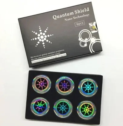 Six gold and silver anti-radiation phone stickers on backing sheet