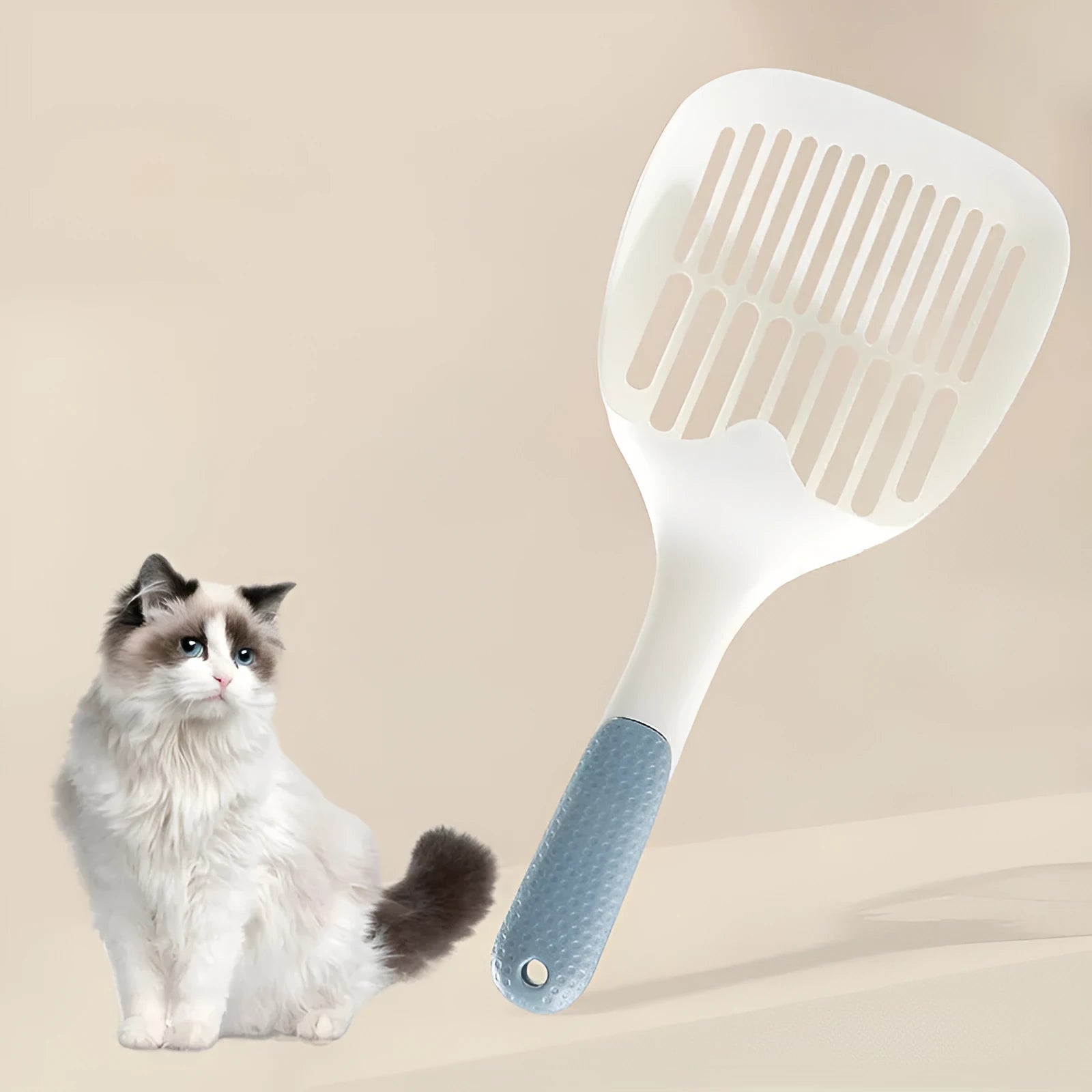 Large white plastic cat litter shovel with a slotted scoop head and handle.