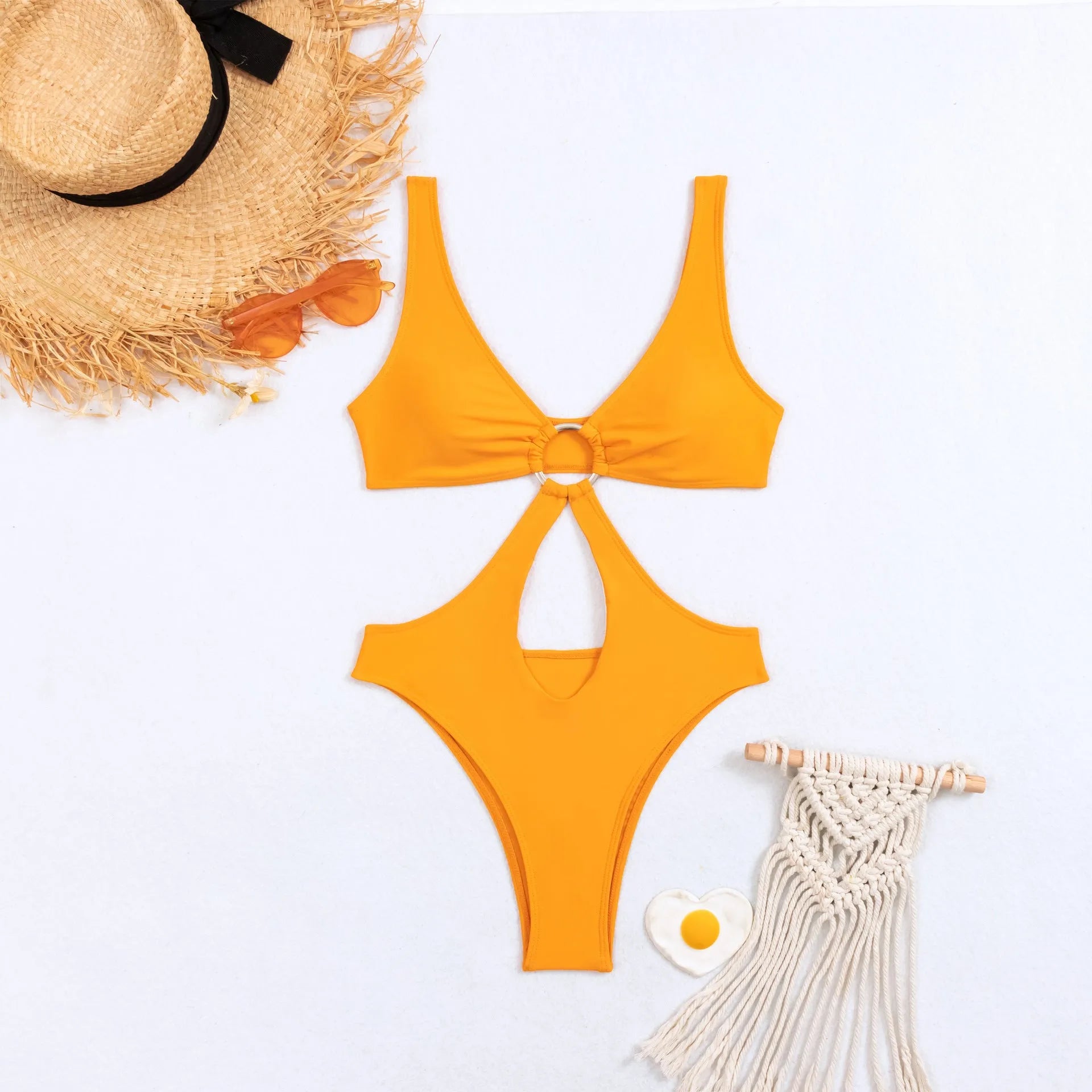 Women's black one-piece swimsuit with sleeveless design and triangle top, made from nylon fabric