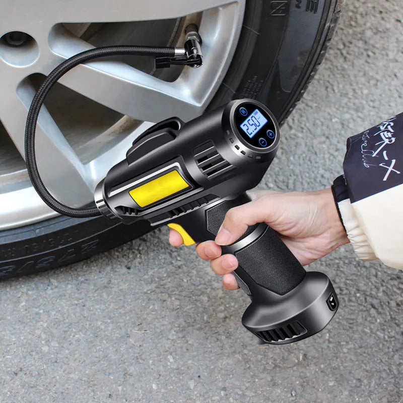 Black wireless digital display electric tyre inflator with USB cable and three air nozzles on a white background.