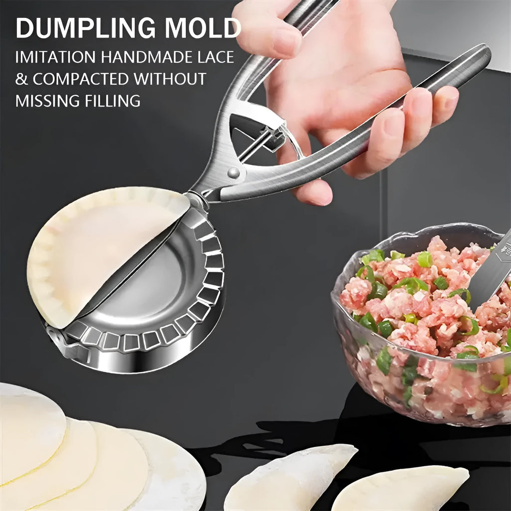 Silver stainless steel manual dumpling press mould with handle on a kitchen worktop.