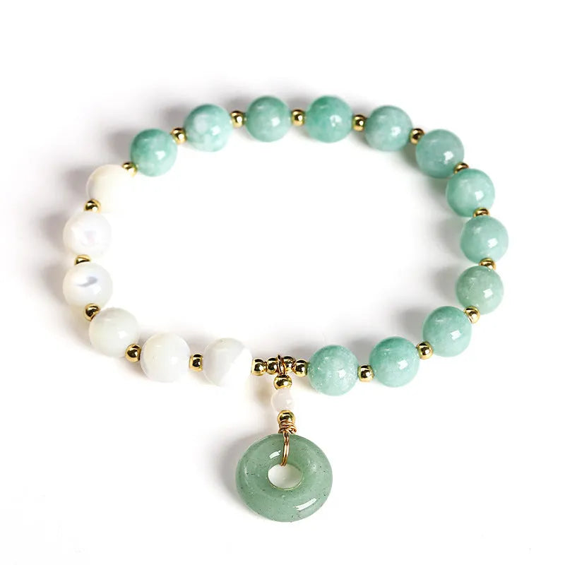 Blue Burma jade bracelet with 8mm round beads and a silver safety buckle clasp.