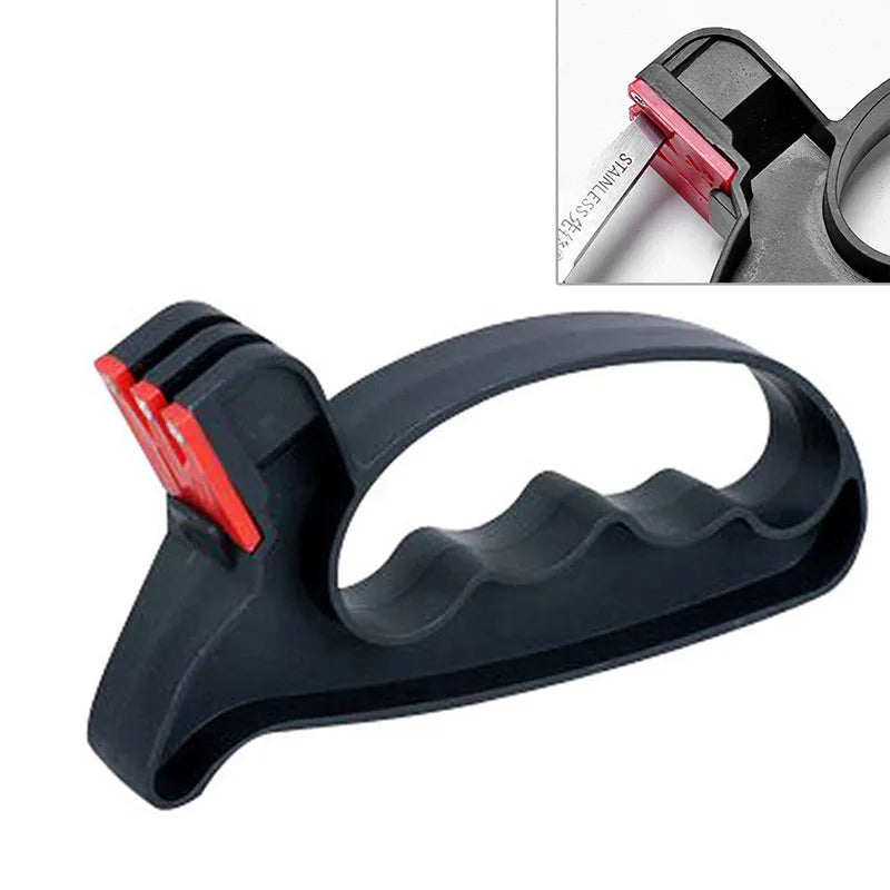 Black handheld tungsten steel knife and scissor sharpener on a kitchen counter