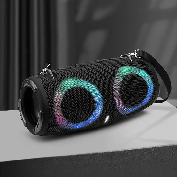 War Drum Bluetooth speaker with RGB lights in black colour, showing strap and button controls for portable outdoor audio