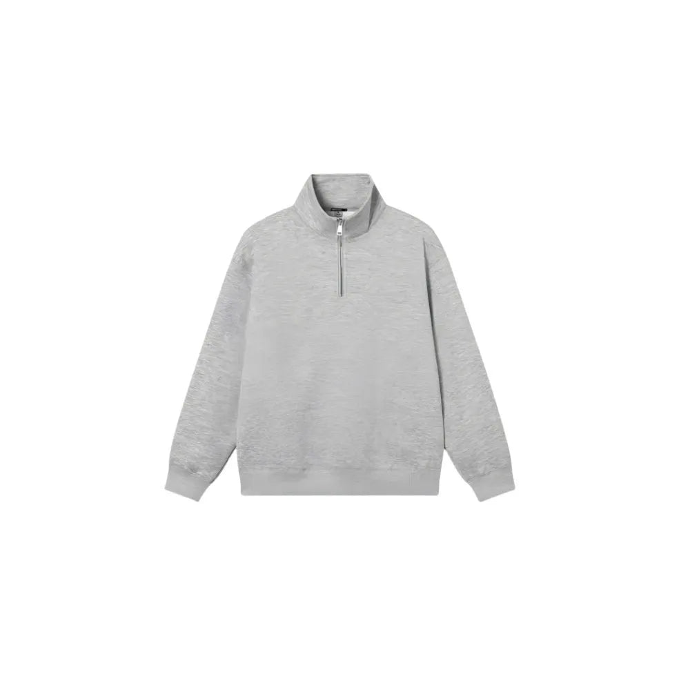 Half-zipped grey cotton sweatshirt with stand collar, long sleeves, and casual grunge style texture