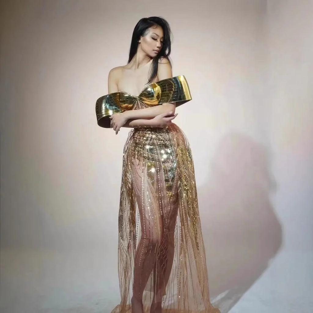 Gold strapless sequin dress with tulle overlay and a long split skirt