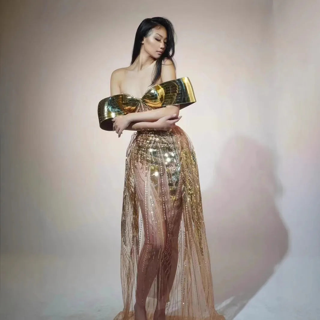 Gold strapless sequin dress with tulle overlay and a long split skirt