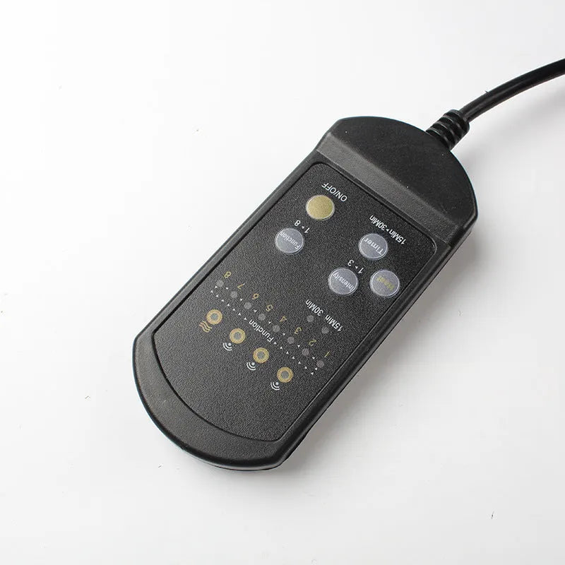 Black heating massage mat with infrared physiotherapy function and continuously variable speed control on seat cushion
