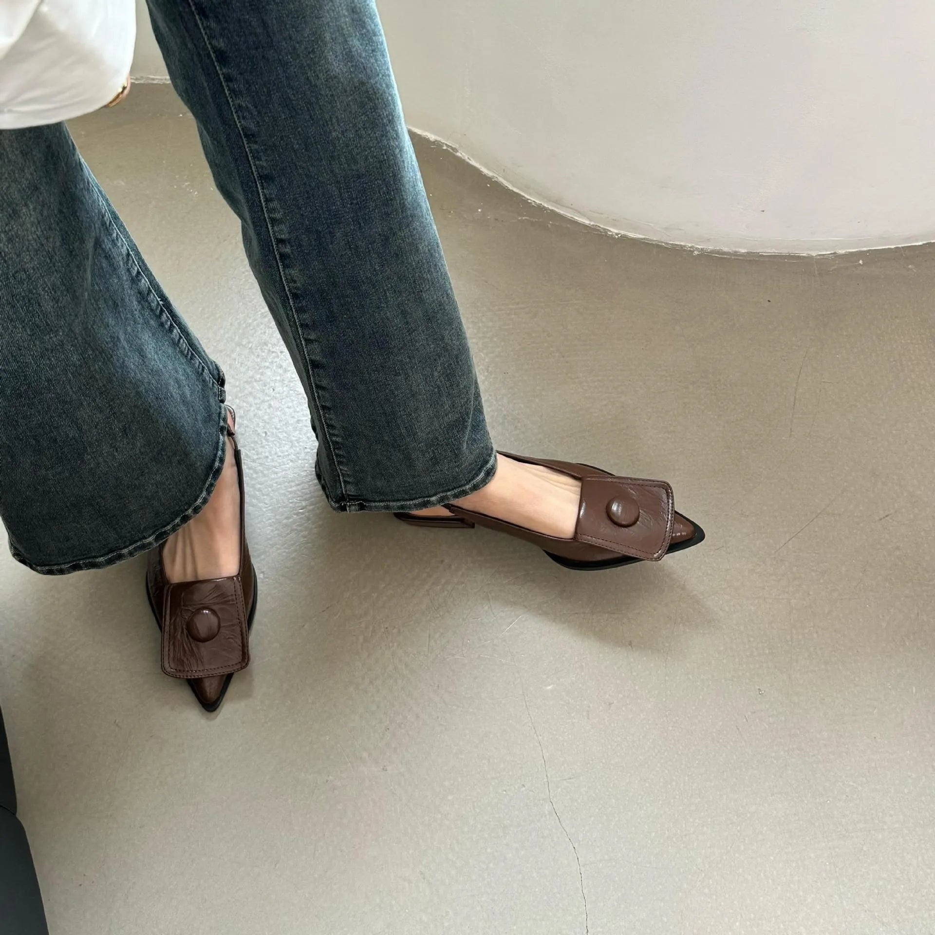 Women's low heel sandals with pointed closed toe and back strap in apricot colour