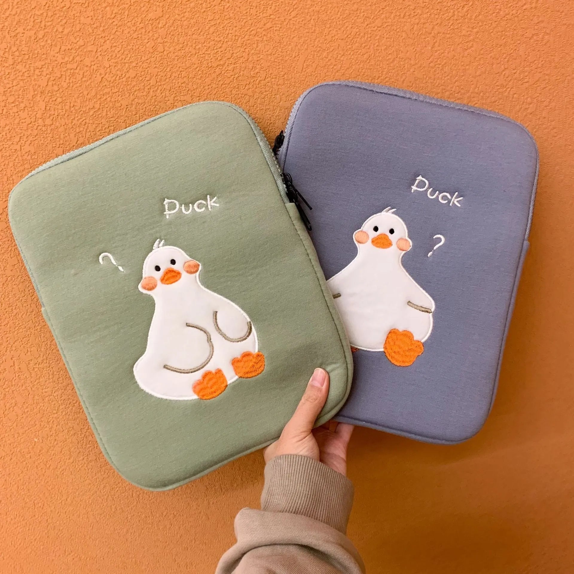 Blue cotton tablet case with cartoon duck embroidery and zipper closure for 11-inch tablets