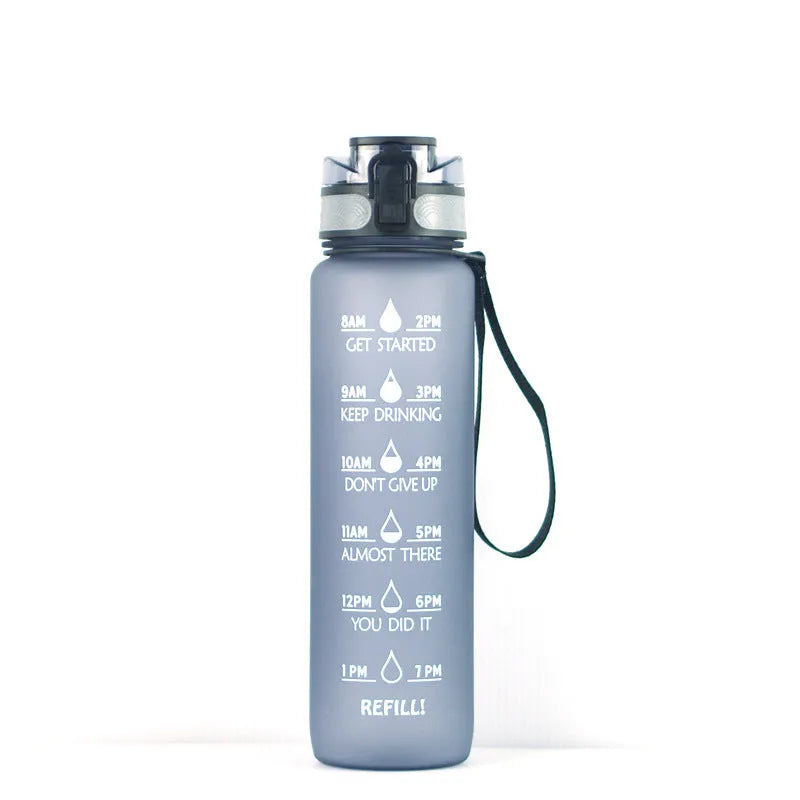 Clear 1000ml Tritan sports water bottle with blue lid and infuser inside, showing measurements.