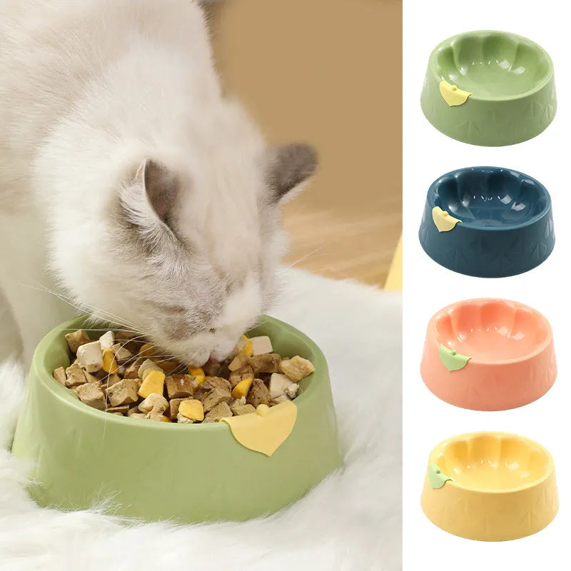 Flower-shaped green plastic double pet bowl for cat and dog food and water on a white surface.