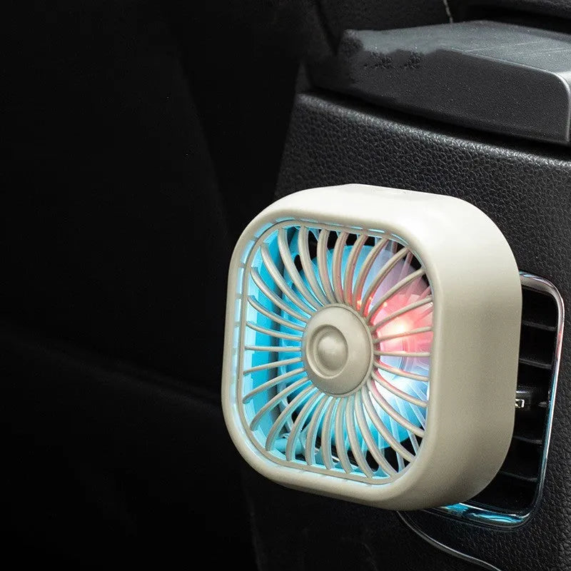 Black car USB fan mounted on vehicle air vent with three speed buttons and USB cable