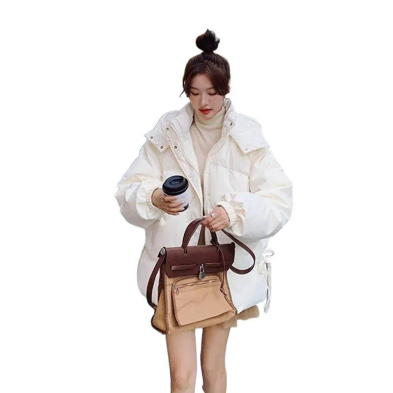 Milky white women's sleeveless loose cotton-padded jacket with princess sleeves on a hanger.