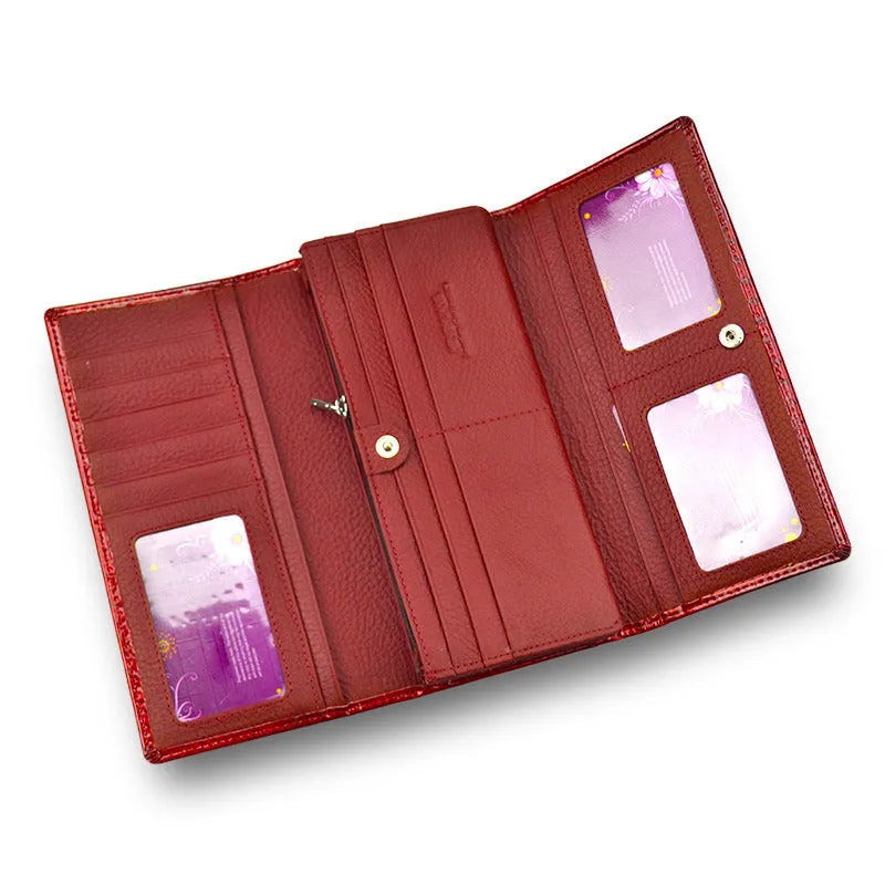 Women's leather purse with crocodile pattern design in wine red colour showing interior pigskin lining