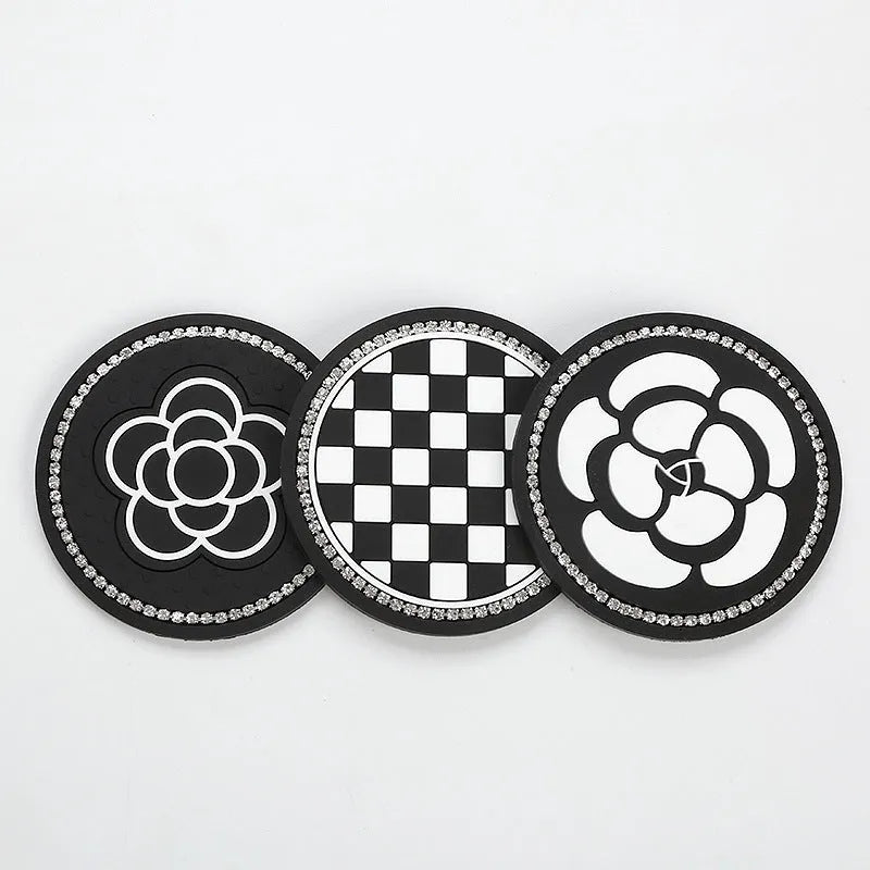 Black and white checkerboard plastic car cup mat placed in a vehicle door slot.
