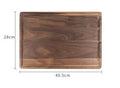 Black walnut wood cutting board with sauce groove and side handle in round and rectangular sizes